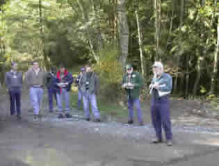 RTI’s Larry Mason leads a tour group through the riparian demonstration site at Pack Forest